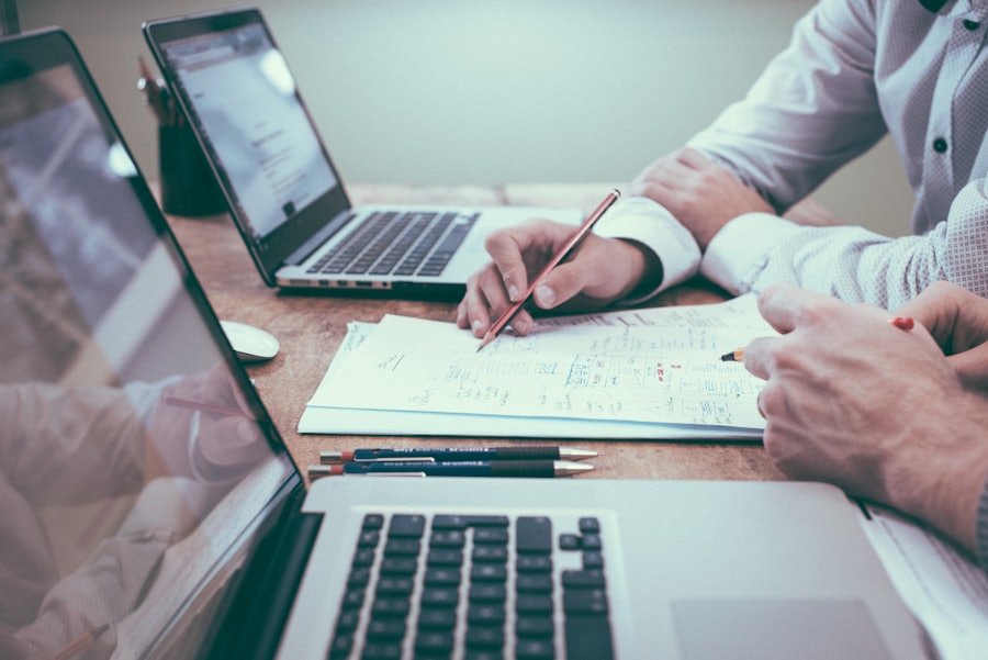Financial advisors reviewing a debt-resolution plan with a client in a professional meeting